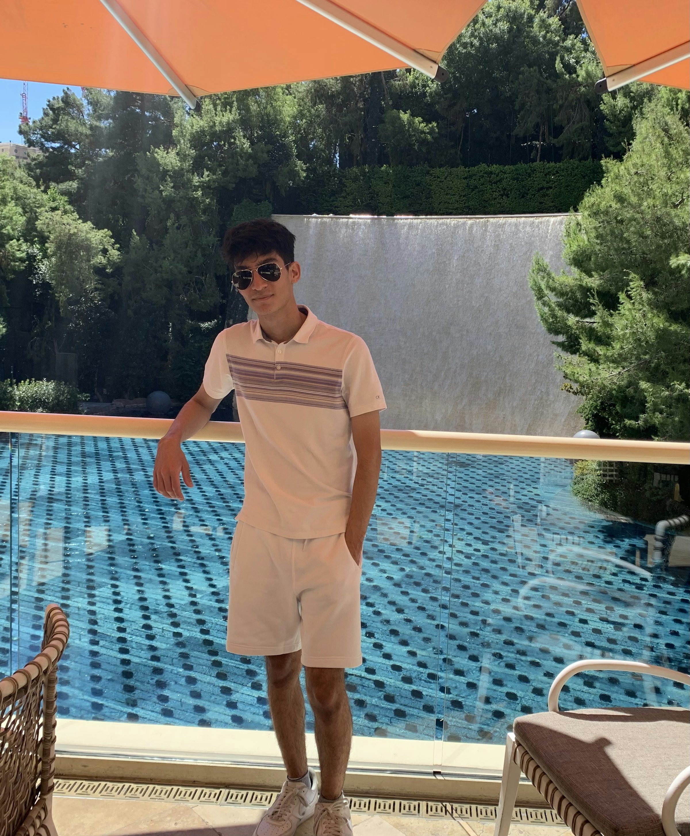 Photo of me leaning on a balcony at the Wynn Hotel in Las Vegas